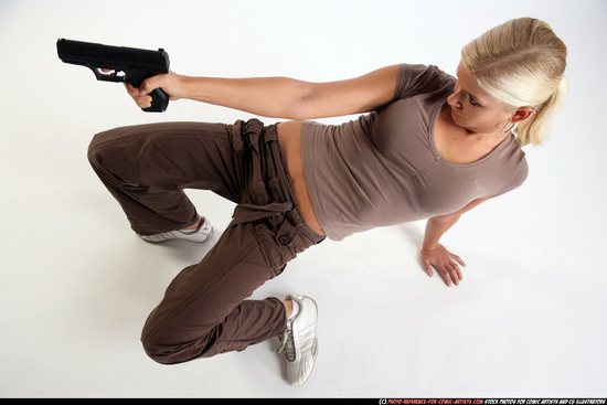 Woman Young Athletic White Fighting with gun Kneeling poses Sportswear