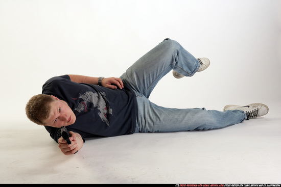 Man Adult Average White Fighting with gun Laying poses Sportswear