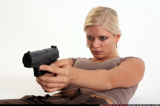 Woman Adult Athletic White Fighting with gun Laying poses Sportswear