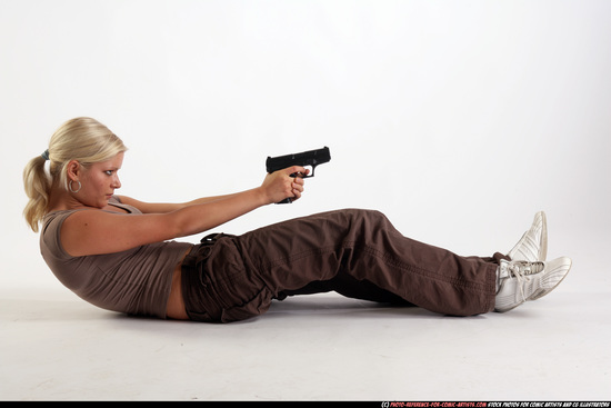 Woman Adult Athletic White Fighting with gun Laying poses Sportswear