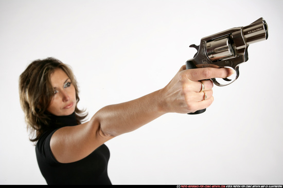 Woman Adult Average White Fighting with gun Standing poses Sportswear