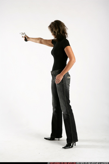 Woman Adult Average White Fighting with gun Standing poses Sportswear