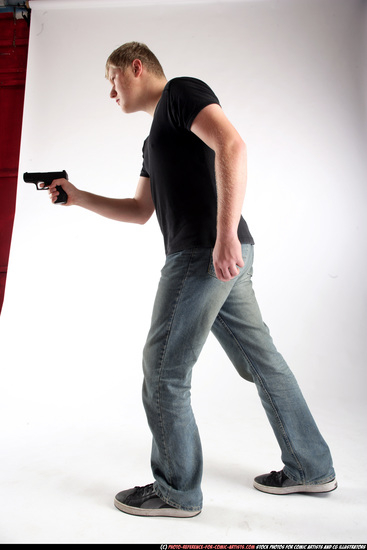 Man Adult Average White Fighting with gun Standing poses Sportswear