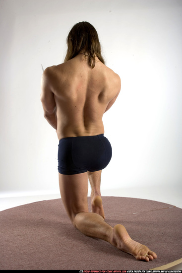 Man Adult Muscular White Fighting with sword Kneeling poses Underwear