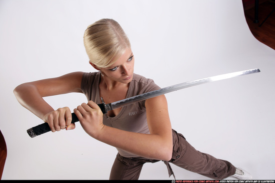 Woman Young Athletic White Fighting with sword Standing poses Sportswear