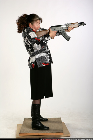 Woman Old Average White Fighting with submachine gun Standing poses Casual