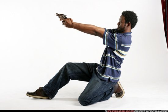 Man Young Athletic Black Fighting with gun Kneeling poses Sportswear