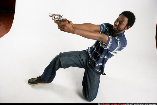 Man Young Athletic Black Fighting with gun Kneeling poses Sportswear