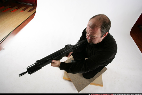 Man Old Chubby White Fighting with submachine gun Kneeling poses Casual