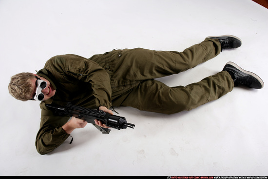 Man Adult Average White Fighting with submachine gun Laying poses Army