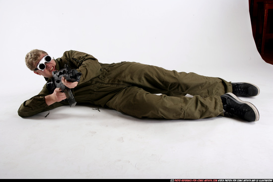 Man Adult Average White Fighting with submachine gun Laying poses Army