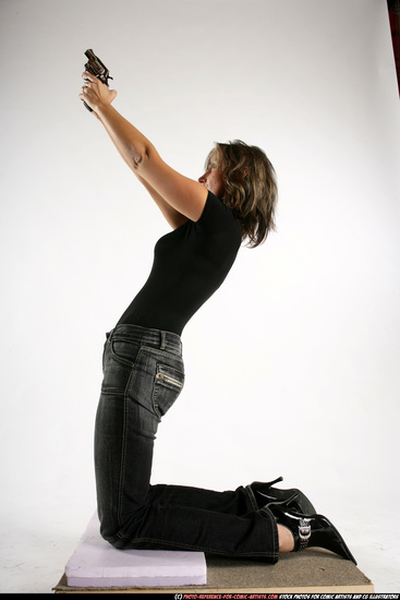 Woman Adult Average White Fighting with gun Kneeling poses Casual