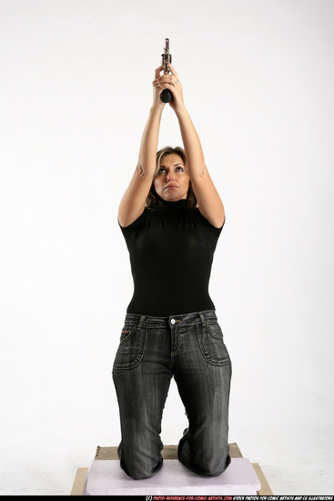 Woman Adult Average White Fighting with gun Kneeling poses Casual