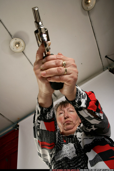 Woman Old Average White Fighting with gun Standing poses Casual