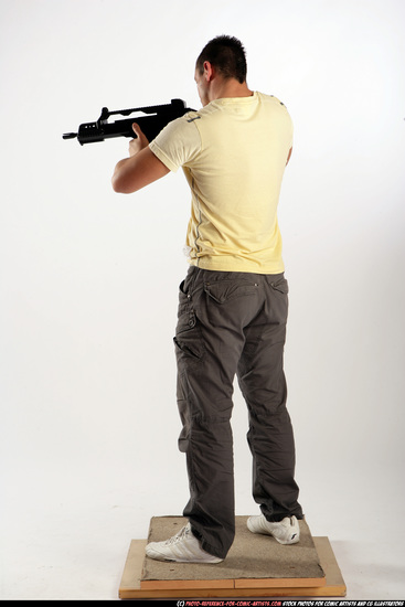 Man Adult Athletic White Fighting with submachine gun Standing poses Sportswear