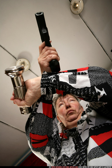 Woman Old Average White Fighting with gun Sitting poses Casual