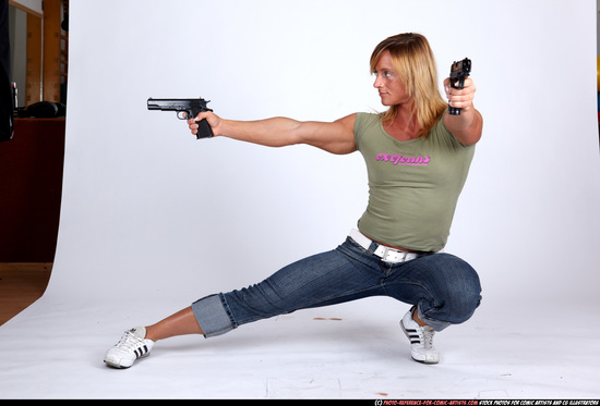 Woman Adult Muscular White Fighting with gun Kneeling poses Sportswear