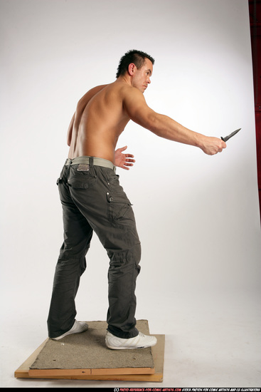 Man Adult Athletic White Fighting with knife Standing poses Pants