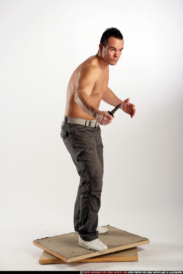 Man Adult Athletic White Fighting with knife Standing poses Pants