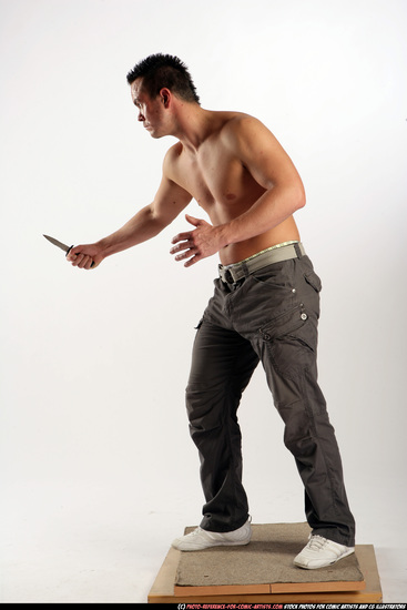 Man Adult Athletic White Fighting with knife Standing poses Pants