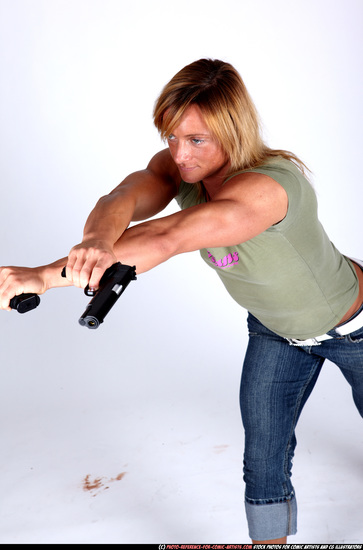 Woman Adult Muscular White Fighting with gun Standing poses Sportswear