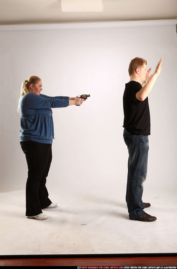 Man & Woman Adult Average White Fighting with gun Standing poses Casual