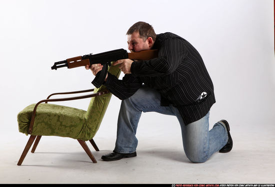 Man Adult Chubby White Fighting with submachine gun Kneeling poses Casual