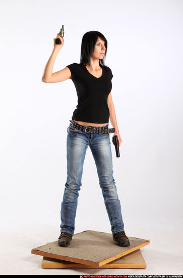 Woman Adult Athletic White Fighting with gun Standing poses Sportswear