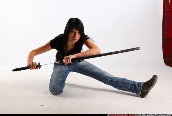 Woman Adult Athletic White Fighting with sword Kneeling poses Sportswear