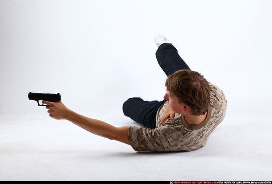 Man Young Athletic White Fighting with gun Laying poses Sportswear