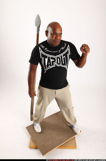 Man Old Average Black Fighting with spear Standing poses Casual