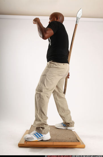 Man Old Average Black Fighting with spear Standing poses Casual