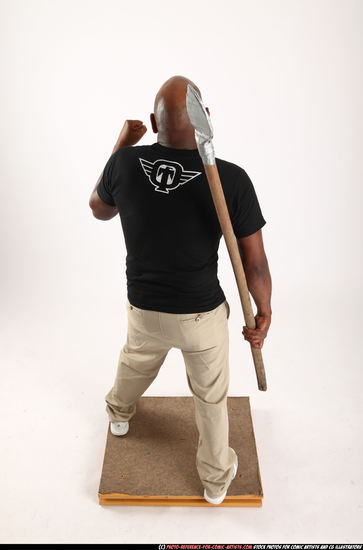 Man Old Average Black Fighting with spear Standing poses Casual