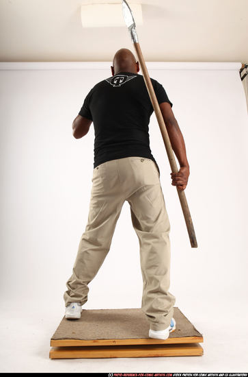 Man Old Average Black Fighting with spear Standing poses Casual