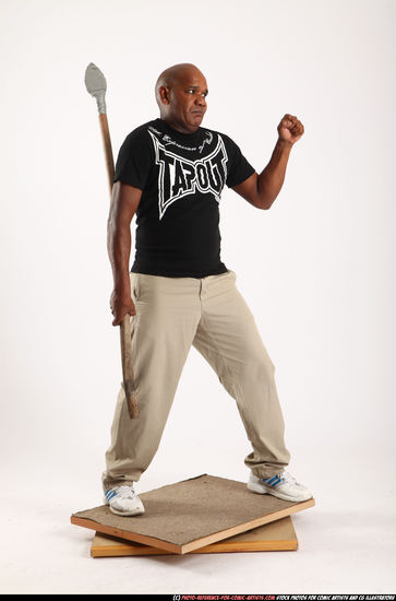 Man Old Average Black Fighting with spear Standing poses Casual