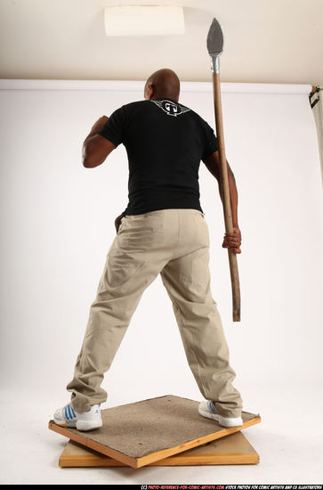 Man Old Average Black Fighting with spear Standing poses Casual