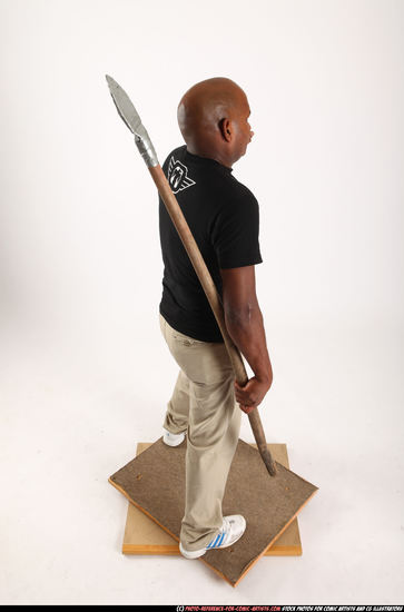 Man Old Average Black Fighting with spear Standing poses Casual