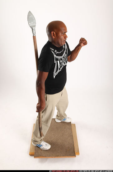 Man Old Average Black Fighting with spear Standing poses Casual