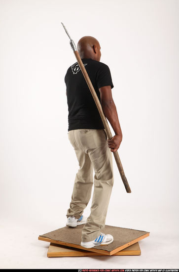 Man Old Average Black Fighting with spear Standing poses Casual