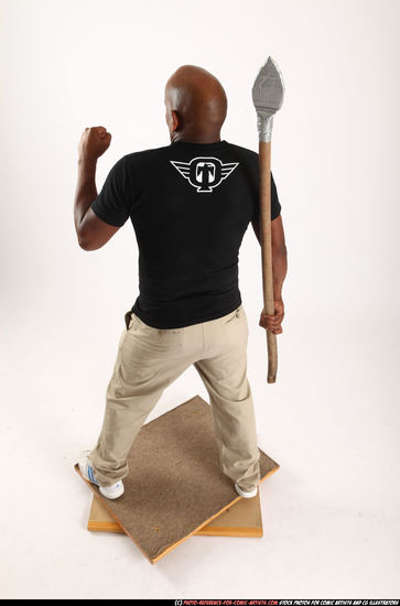 Man Old Average Black Fighting with spear Standing poses Casual