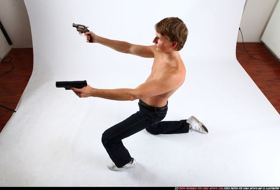 Man Young Athletic White Fighting with gun Kneeling poses Pants