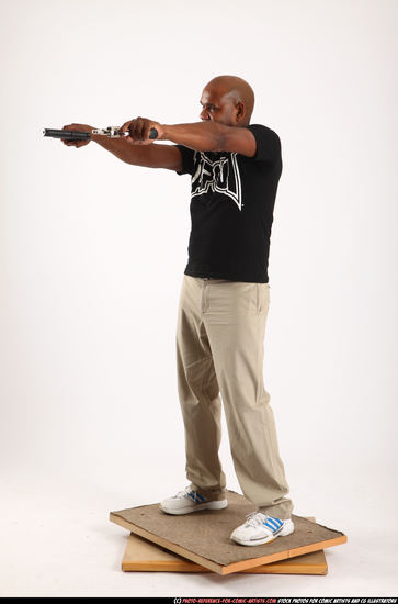 Man Old Average Black Fighting with gun Standing poses Casual