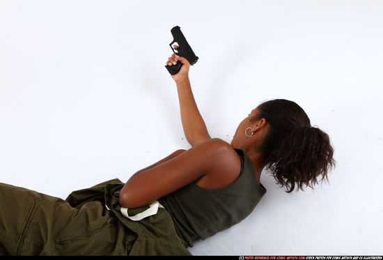 Woman Young Athletic Black Fighting with gun Laying poses Army