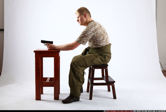 Man Adult Average White Fighting with gun Sitting poses Army