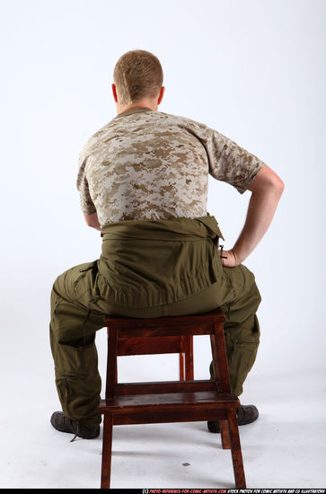 Man Adult Average White Fighting with gun Sitting poses Army