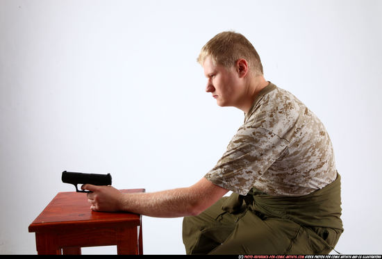 Man Adult Average White Fighting with gun Sitting poses Army