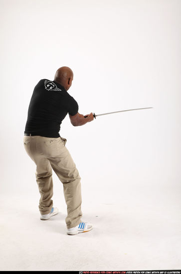 Man Old Average Black Fighting with sword Standing poses Casual