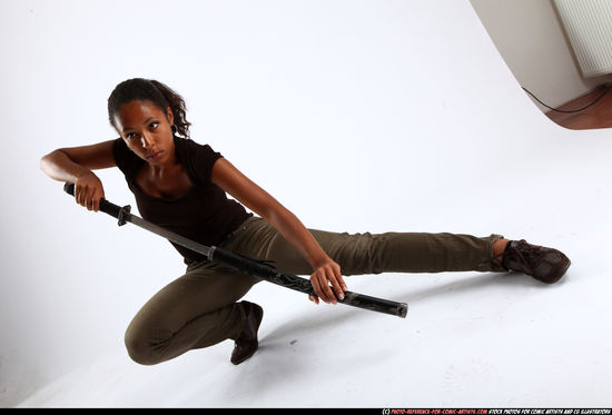 Woman Young Athletic Black Fighting with sword Kneeling poses Casual