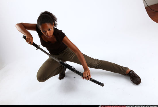 Woman Young Athletic Black Fighting with sword Kneeling poses Casual