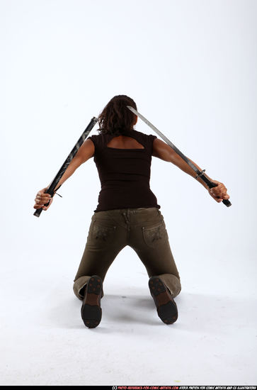 Woman Young Athletic Black Fighting with sword Kneeling poses Casual